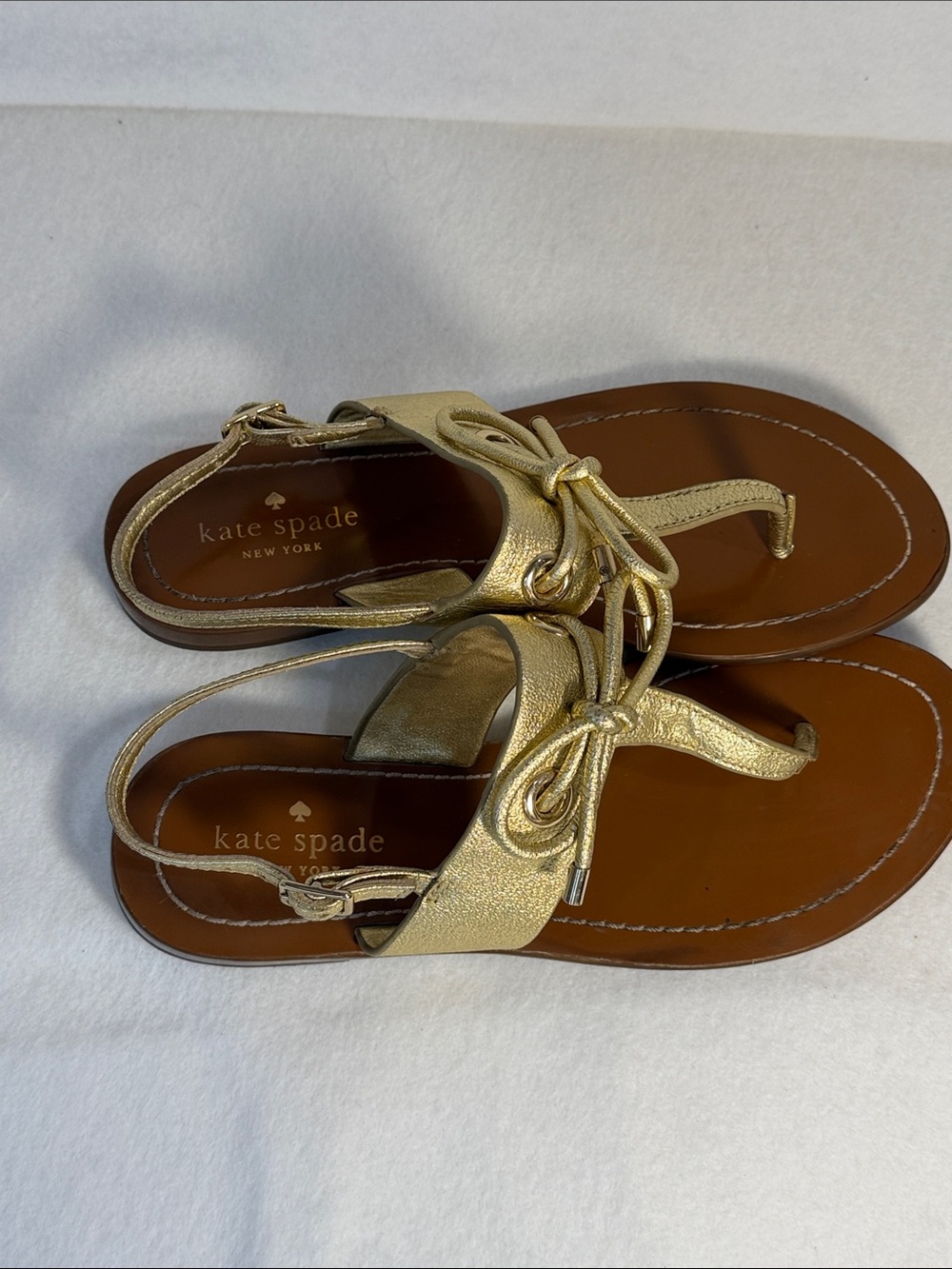 kate spade Metallic Gold Leather Bow Thong Sandals